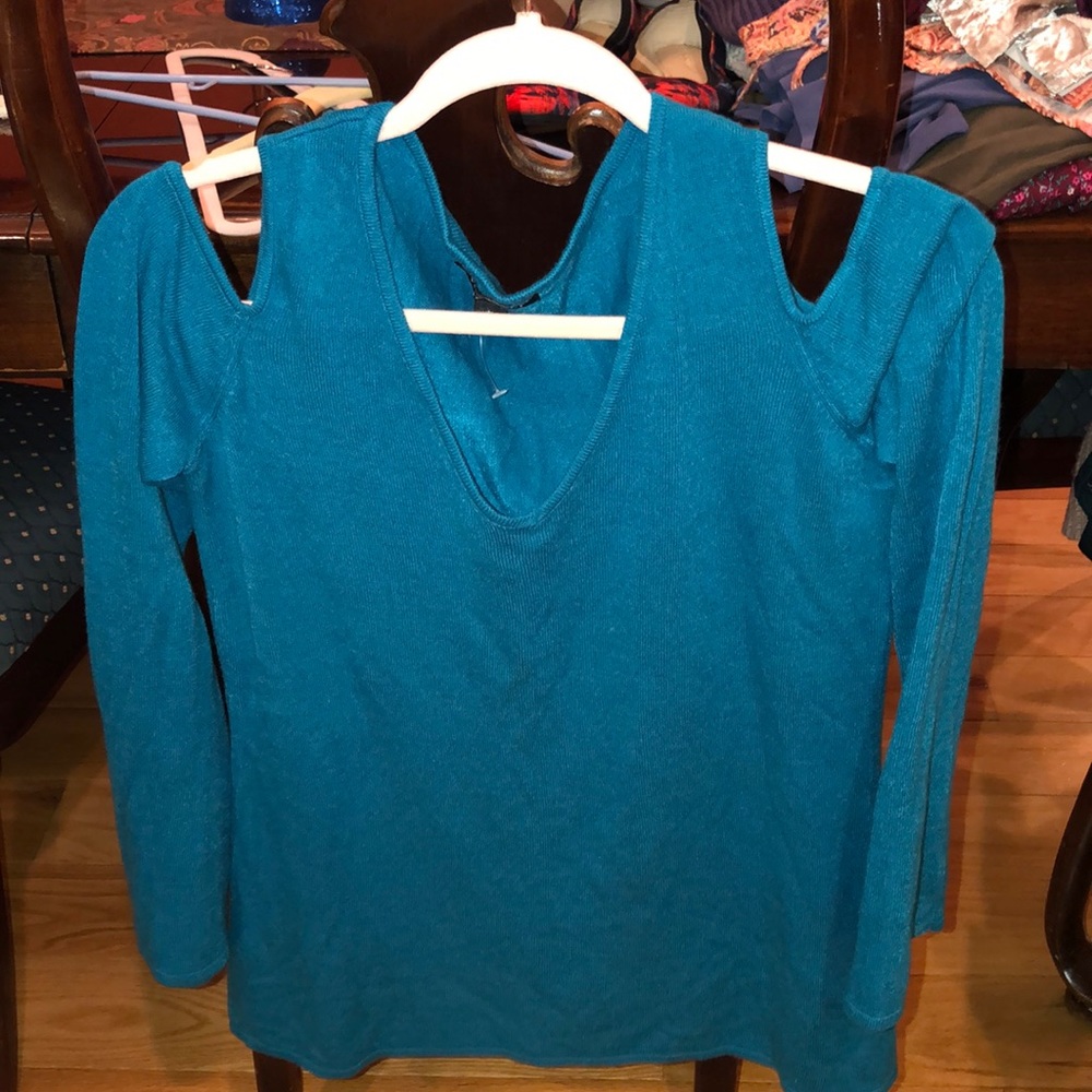 Blue sweater with shoulder slits